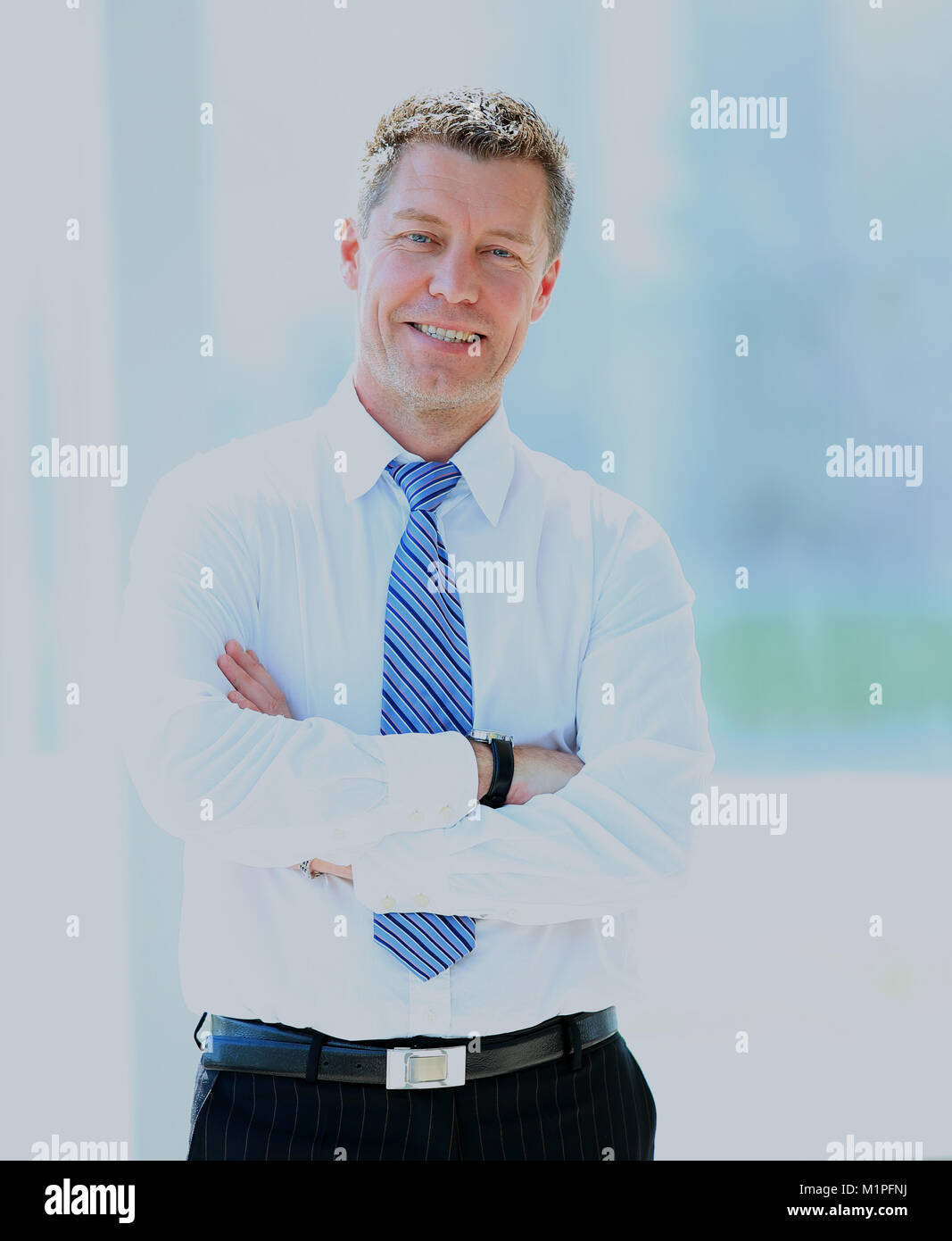 Smiling middle aged business man Stock Photo - Alamy