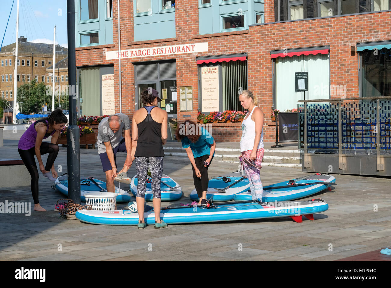 Paddle boarding and meditation class in Gloucester Docks Stock Photo