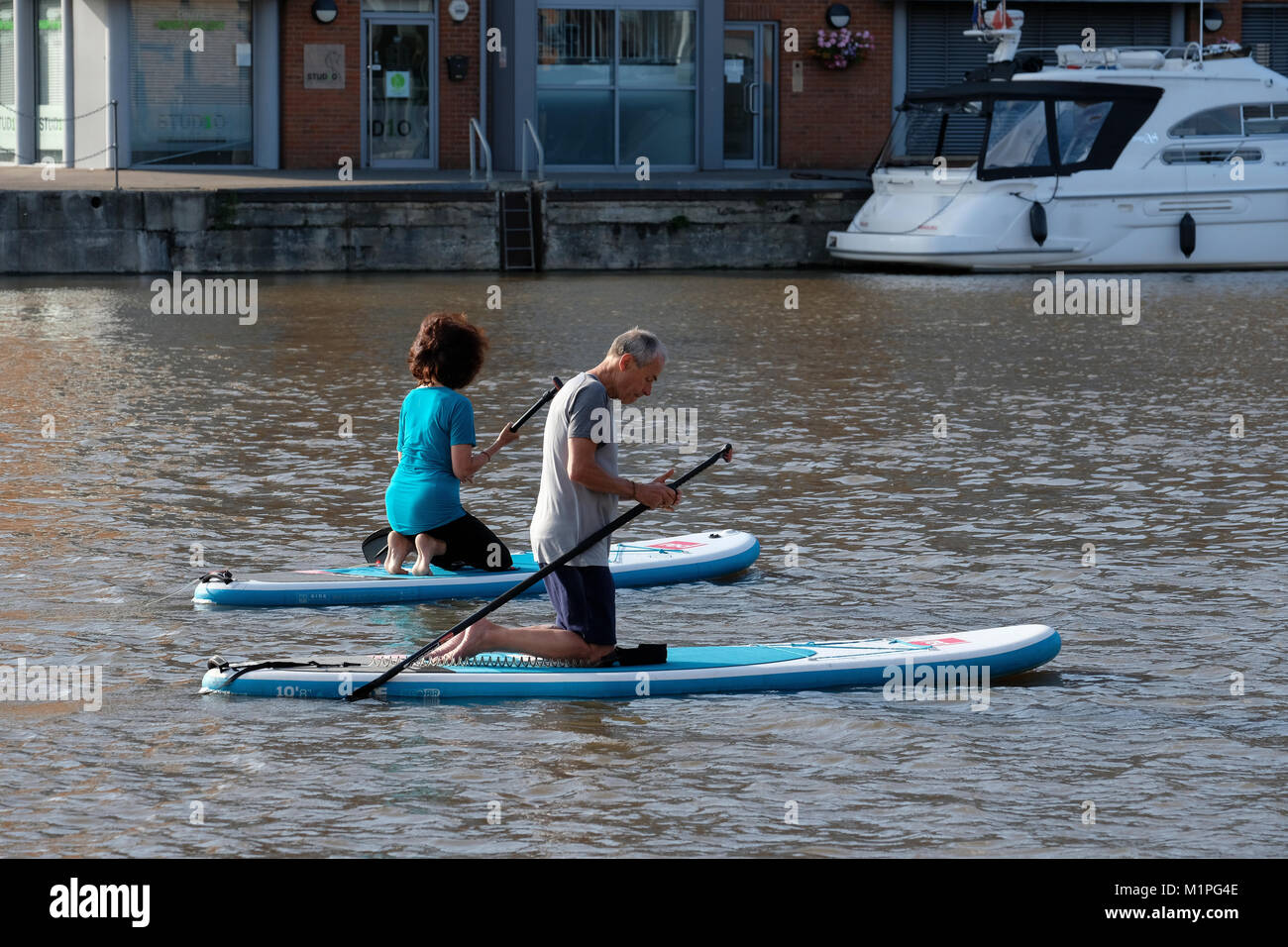 Paddle boarding and meditation class in Gloucester Docks Stock Photo