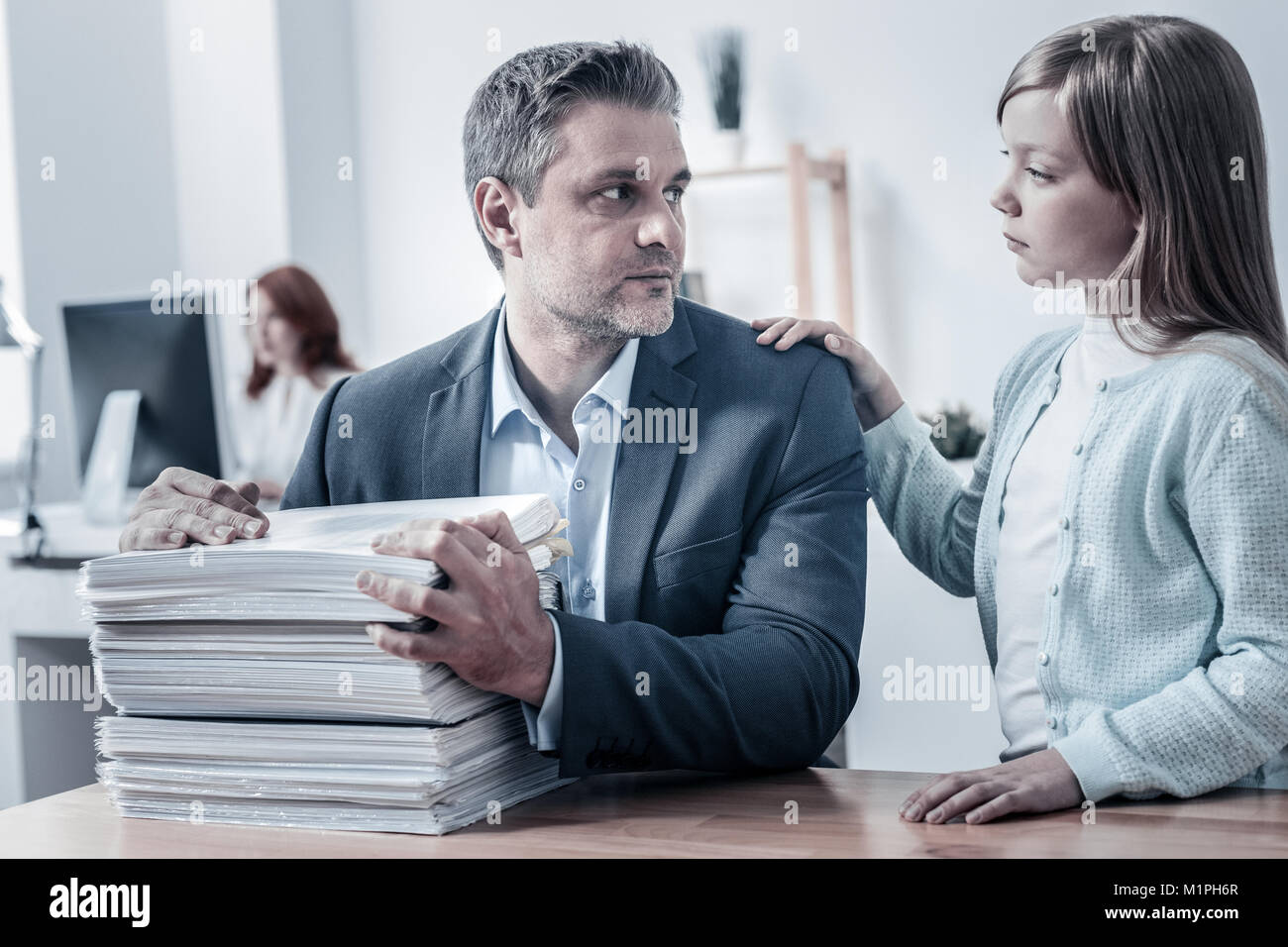 Mindful daughter calming her poor tired father Stock Photo