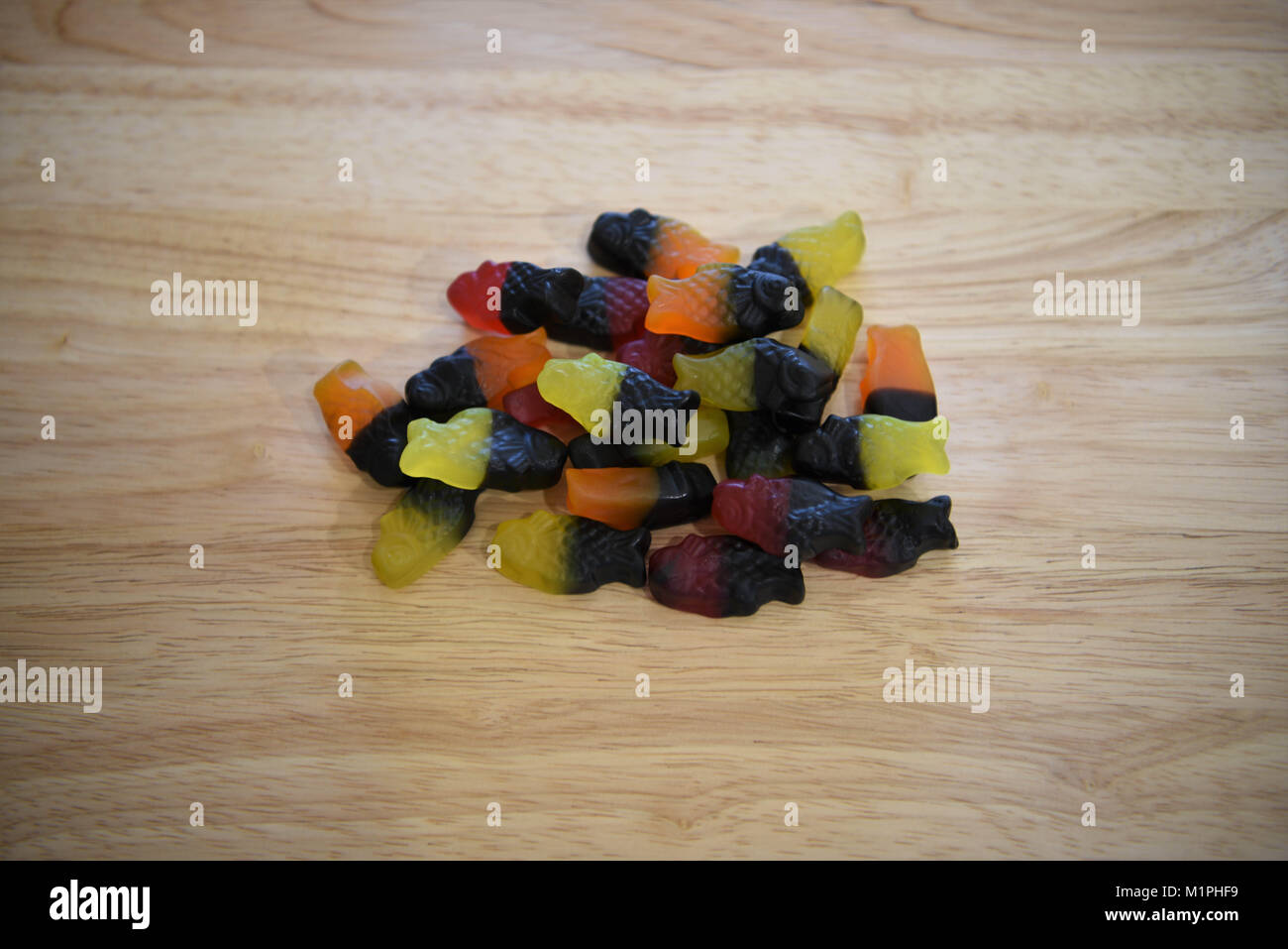 liquorice fish shapes called the Dutch Neon Guppy in fruit flavors for a heap of sweets treats and candy Stock Photo