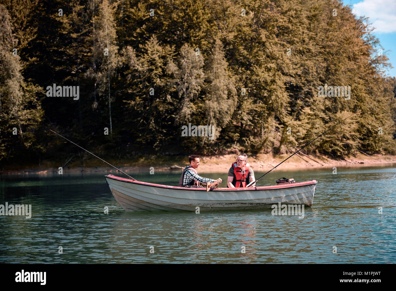 Two men fishing from a boat hi-res stock photography and images - Alamy