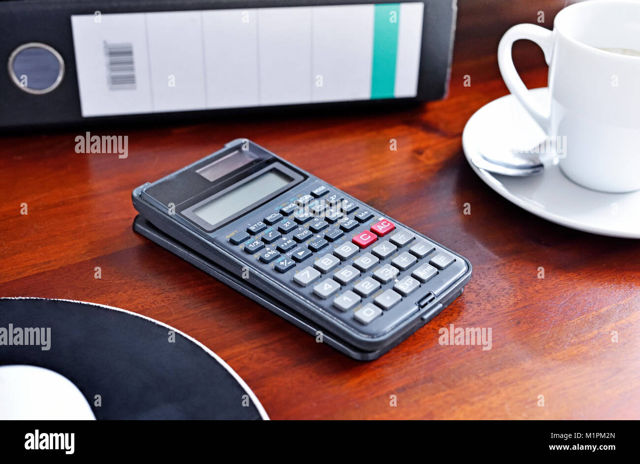 Working place or work place scene with office supply and coffee cup. Coffee break, office scene. Business background with cup of coffee, calculator. Stock Photo