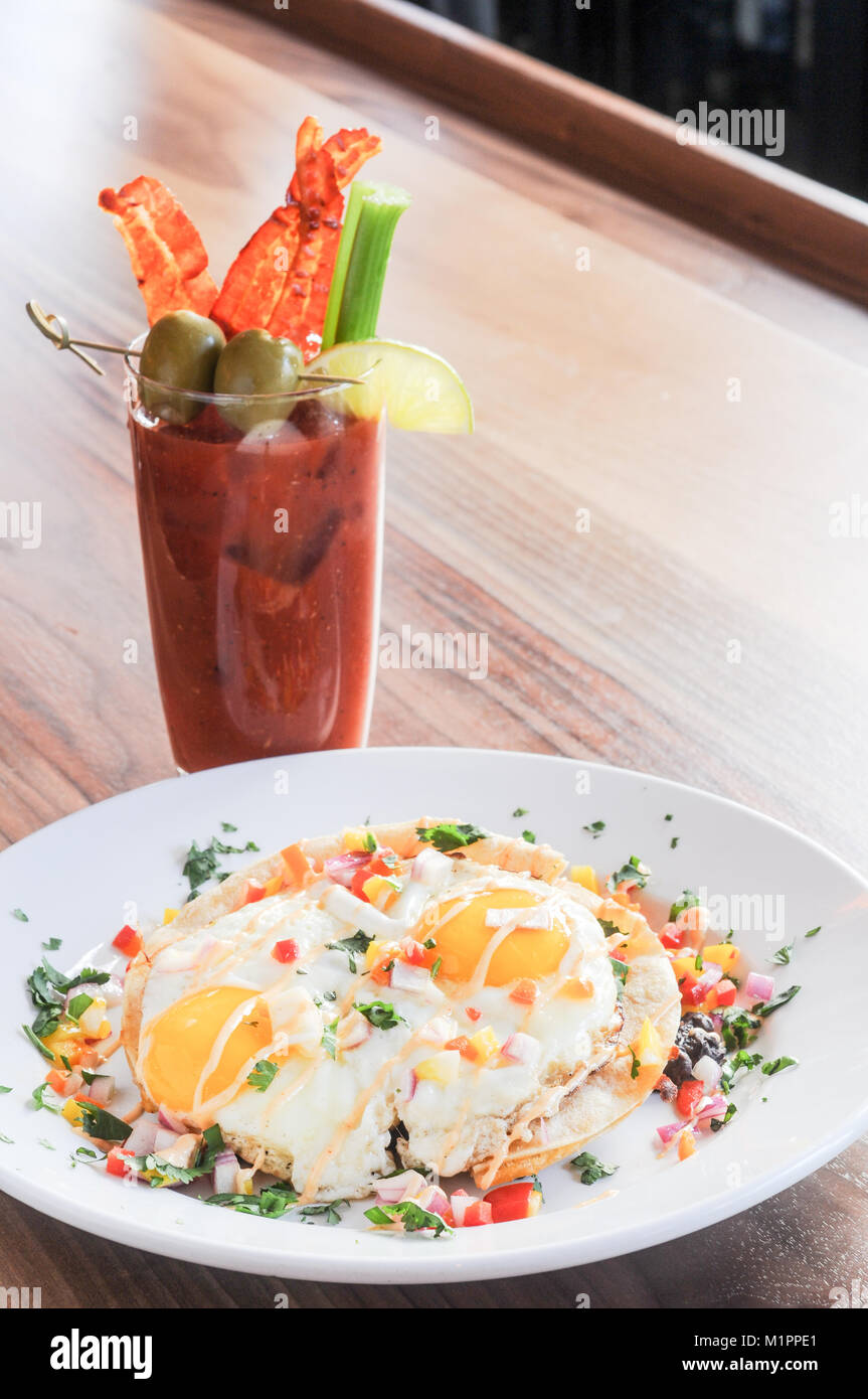 Brunch eggs with a bloody mary Stock Photo Alamy