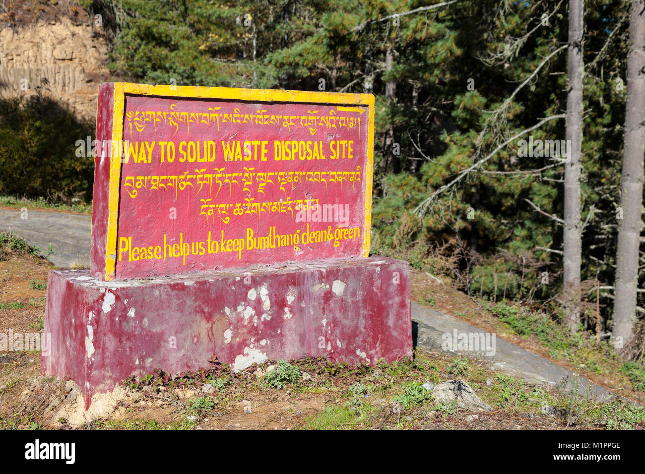 Bumthang, Bhutan.  Keep Bumthang  Clean and Green.  Sign to Solid waste Disposal Site. Stock Photo