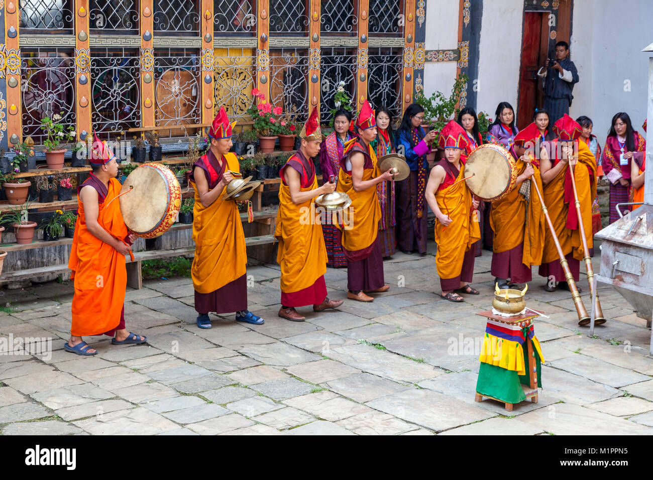 Bumthang, Bhutan.  Buddhist Monks in Religious Ceremony in Courtyard of  Jambay Lhakhang Monastery. Stock Photo