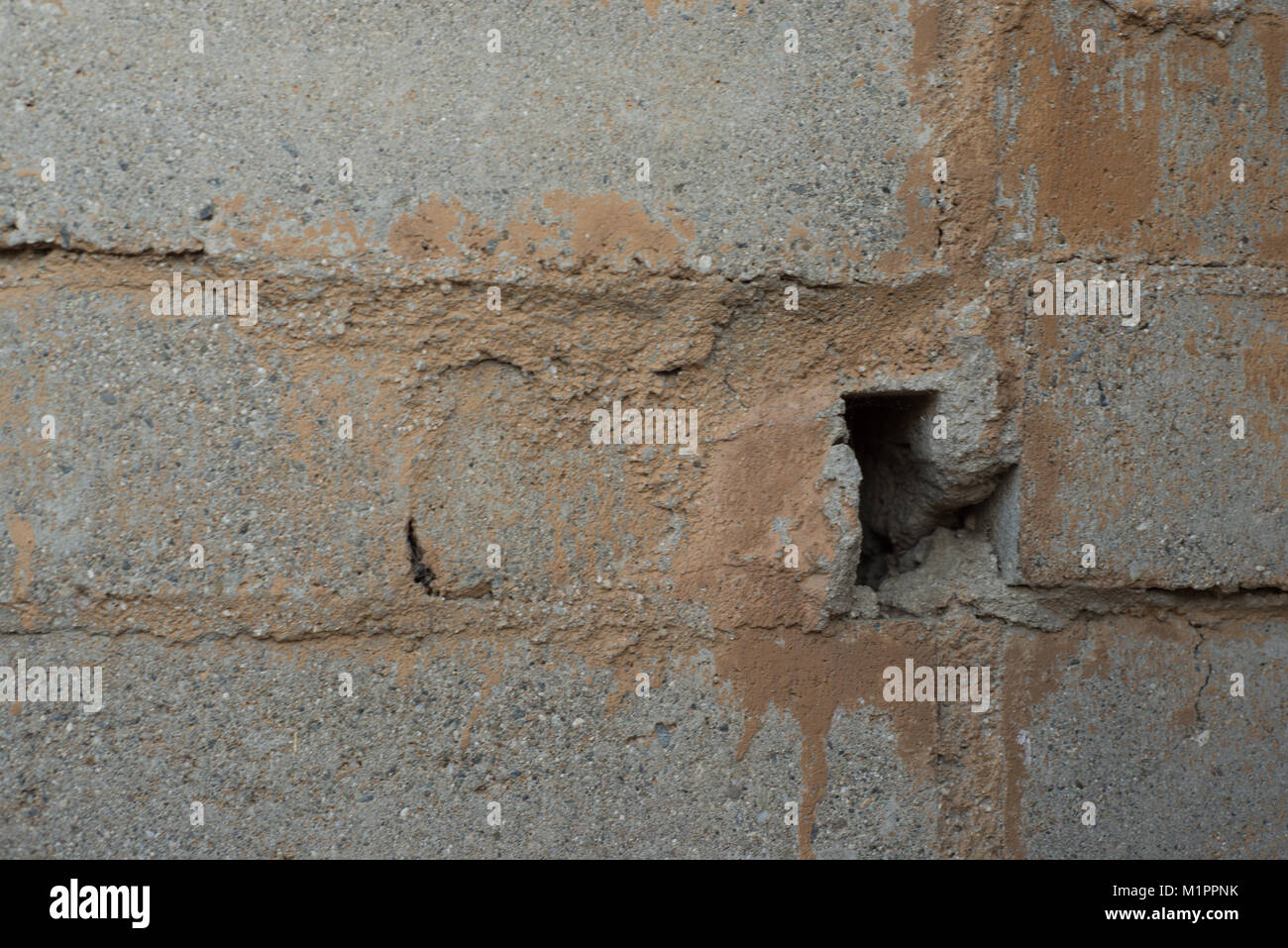 hole in cinder block wall Stock Photo Alamy