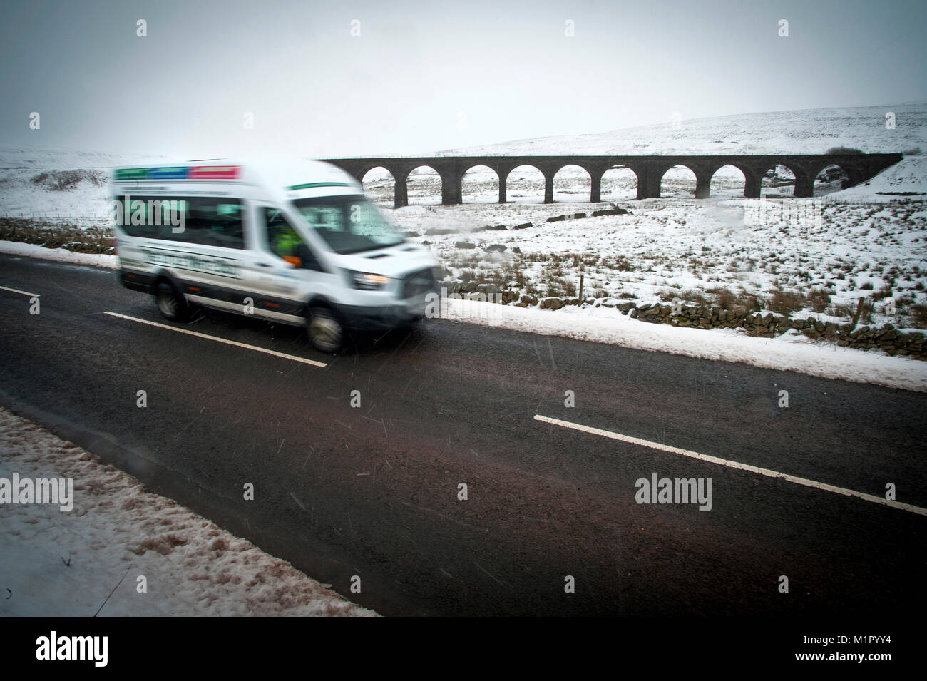 Dave Stephenson driving The Little White Bus on its Sunday run from