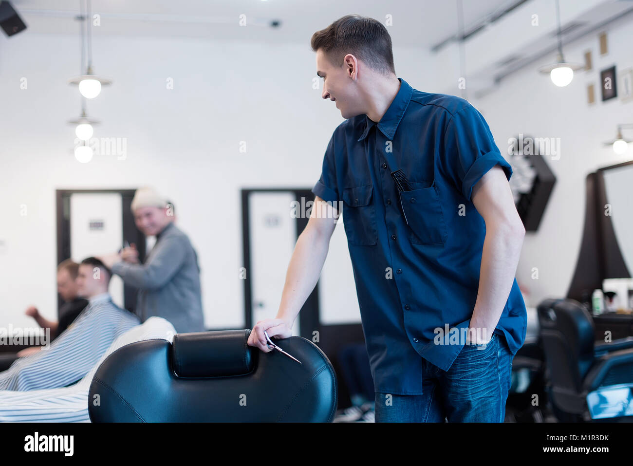 Barber on the chair. Barber expects the client to sit in the chair