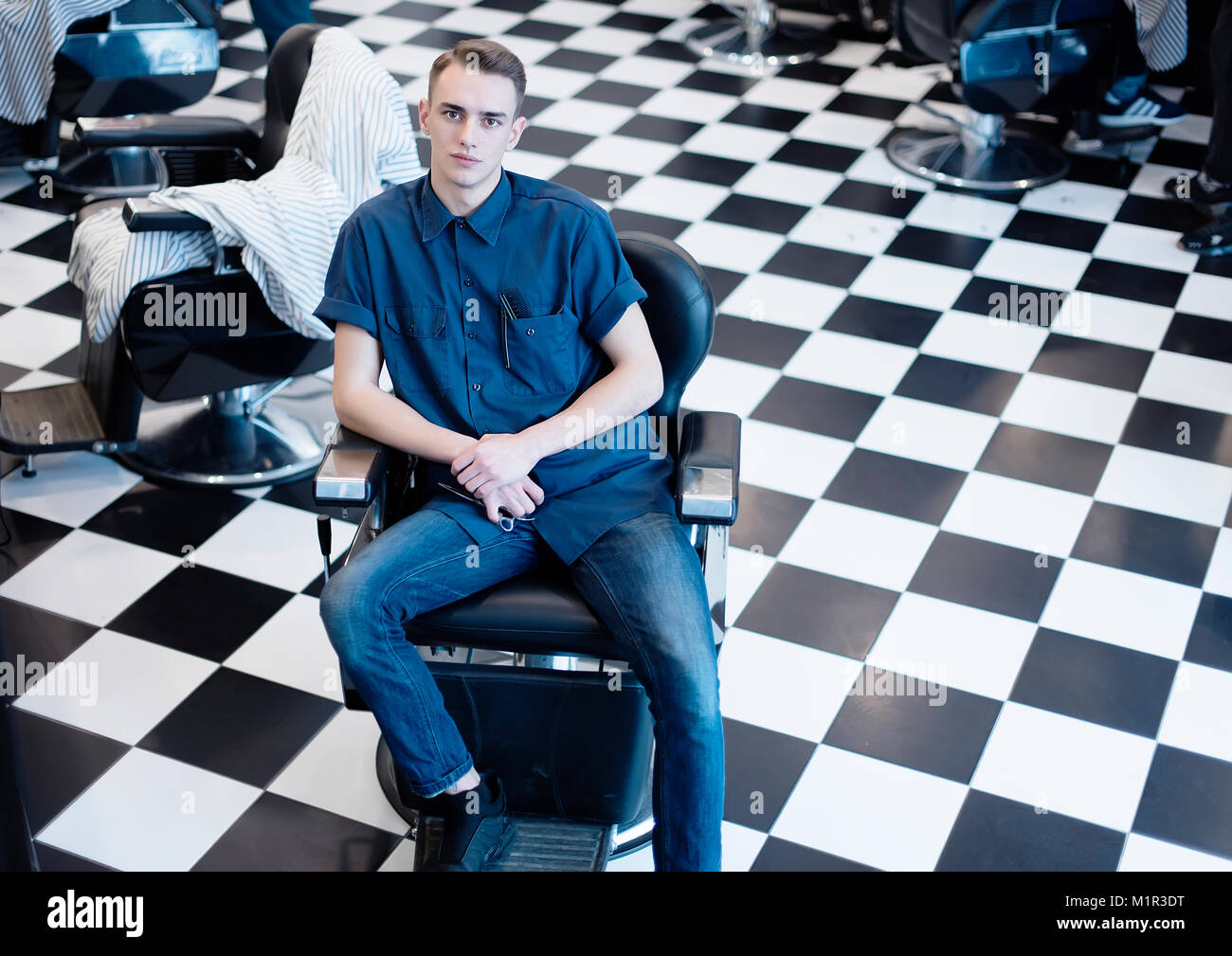 Barber on the chair. Barber expects the client to sit in the chair