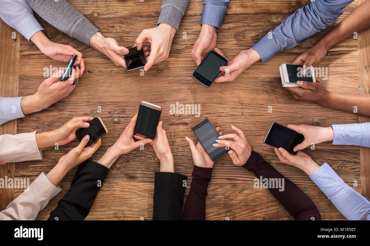 Group people mobile phone hands hi-res stock photography and images - Alamy