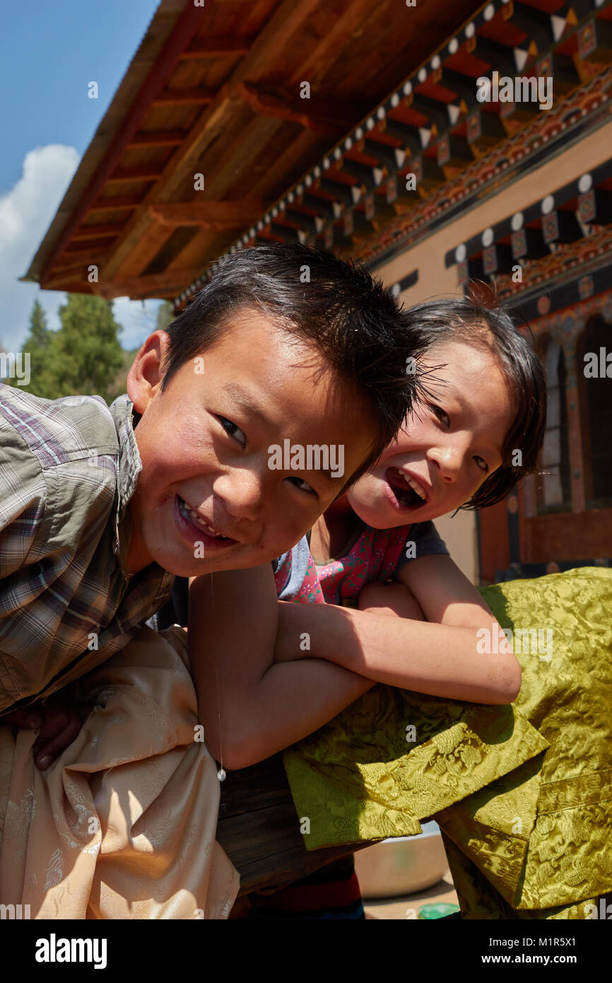 Boy and girl on fence boy and girl on fence hires stock photography