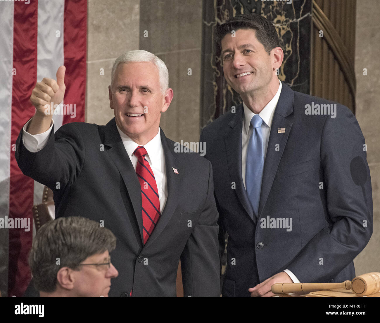 Washington, District of Columbia, USA. 30th Jan, 2018. United States Vice President Mike Pence, left, and Speaker of the US House of Representatives Paul Ryan (Republican of Wisconsin), right, gesture towards guests in the Speaker's gallery prior to the arrival of US President Donald J. Trump who will deliver his first State of the Union address to a joint session of the US Congress in the US House chamber in the US Capitol in Washington, DC on Tuesday, January 30, 2018.Credit: Ron Sachs/CNP Credit: Ron Sachs/CNP/ZUMA Wire/Alamy Live News Stock Photo