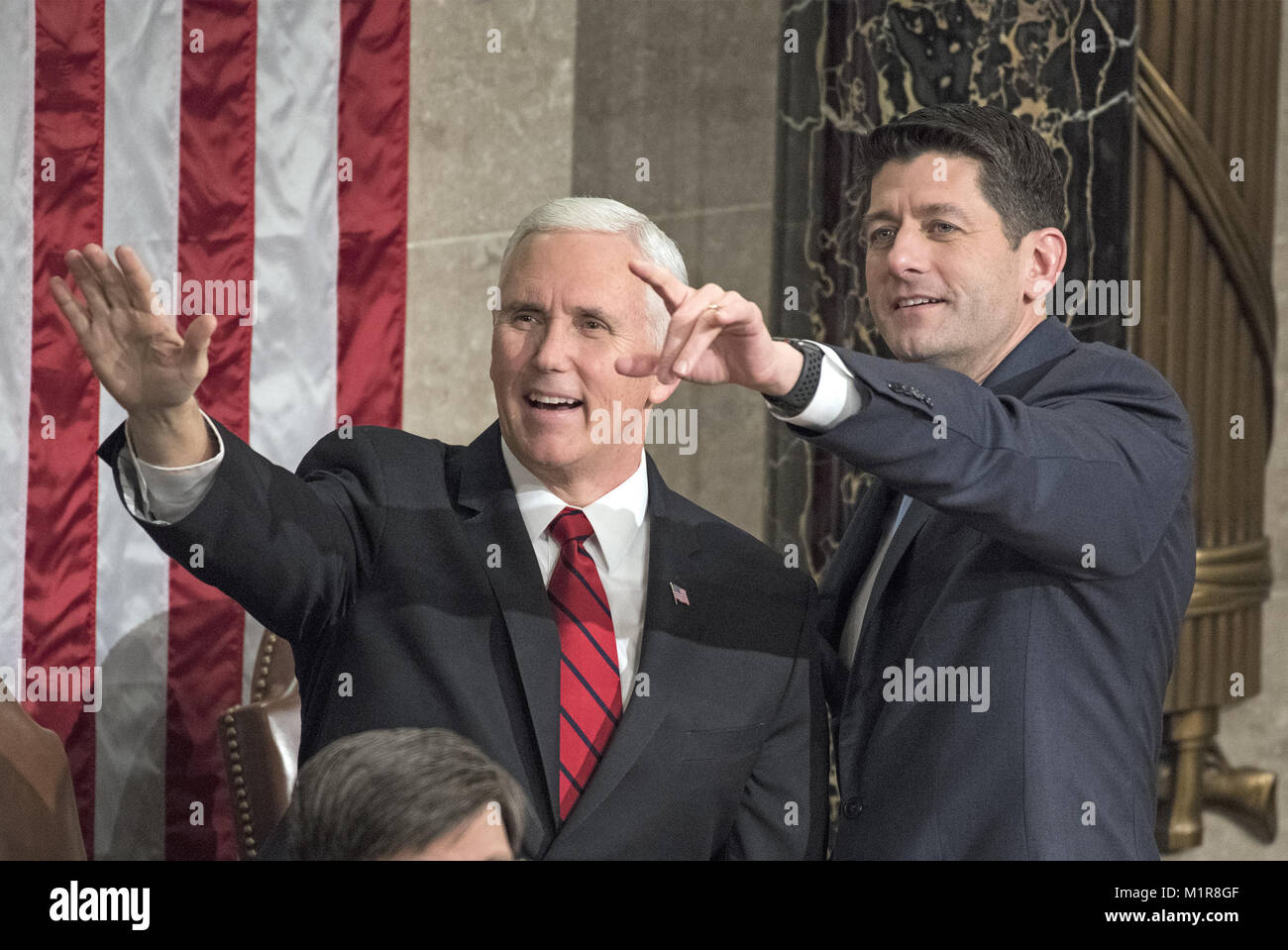 Washington, District of Columbia, USA. 30th Jan, 2018. United States Vice President Mike Pence, left, and Speaker of the US House of Representatives Paul Ryan (Republican of Wisconsin), right, gesture towards guests in the Speaker's gallery prior to the arrival of US President Donald J. Trump who will deliver his first State of the Union address to a joint session of the US Congress in the US House chamber in the US Capitol in Washington, DC on Tuesday, January 30, 2018.Credit: Ron Sachs/CNP Credit: Ron Sachs/CNP/ZUMA Wire/Alamy Live News Stock Photo