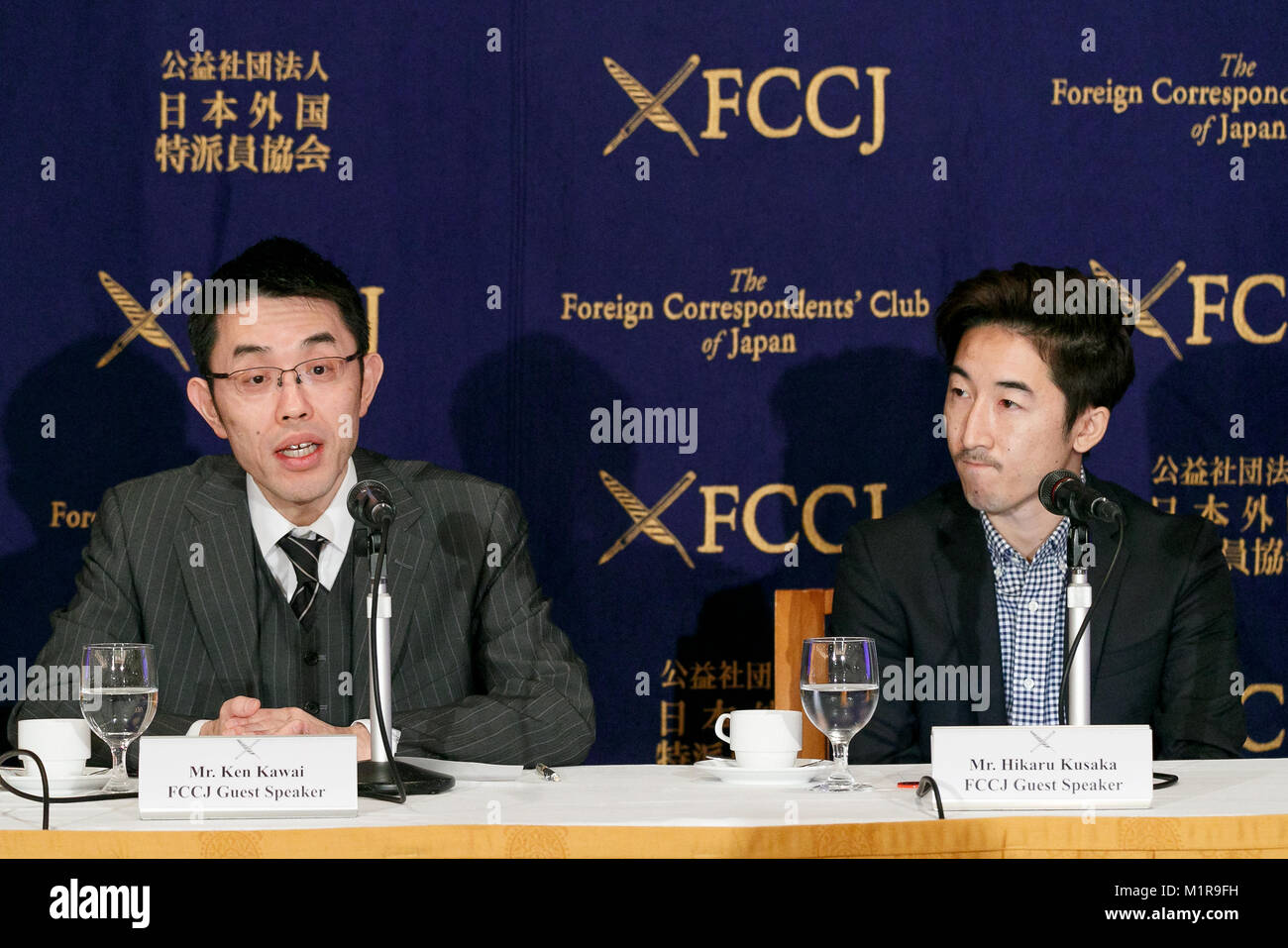 (L to R) Lawyer Ken Kawai and Hikaru Kusaka Co-founder of BLOCKHIVE, speak during a news conference at the Foreign Correspondents' Club of Japan (FCCJ) on February 1, 2018, Tokyo, Japan. Kawai and Kusaka spoke to members of the foreign press their opinions about why Japan decided to recognize financial currencies such as Bitcoin and other cryptocurrencies as legitimate payment methods in 2017. Nevertheless, the vulnerability of the cryptocurrencies has been exposed after Tokyo's Coincheck Inc. admitted losing 58 billion yen ($533 million) in NEM cryptocurrency tokens from roughly 260,000 custo Stock Photo