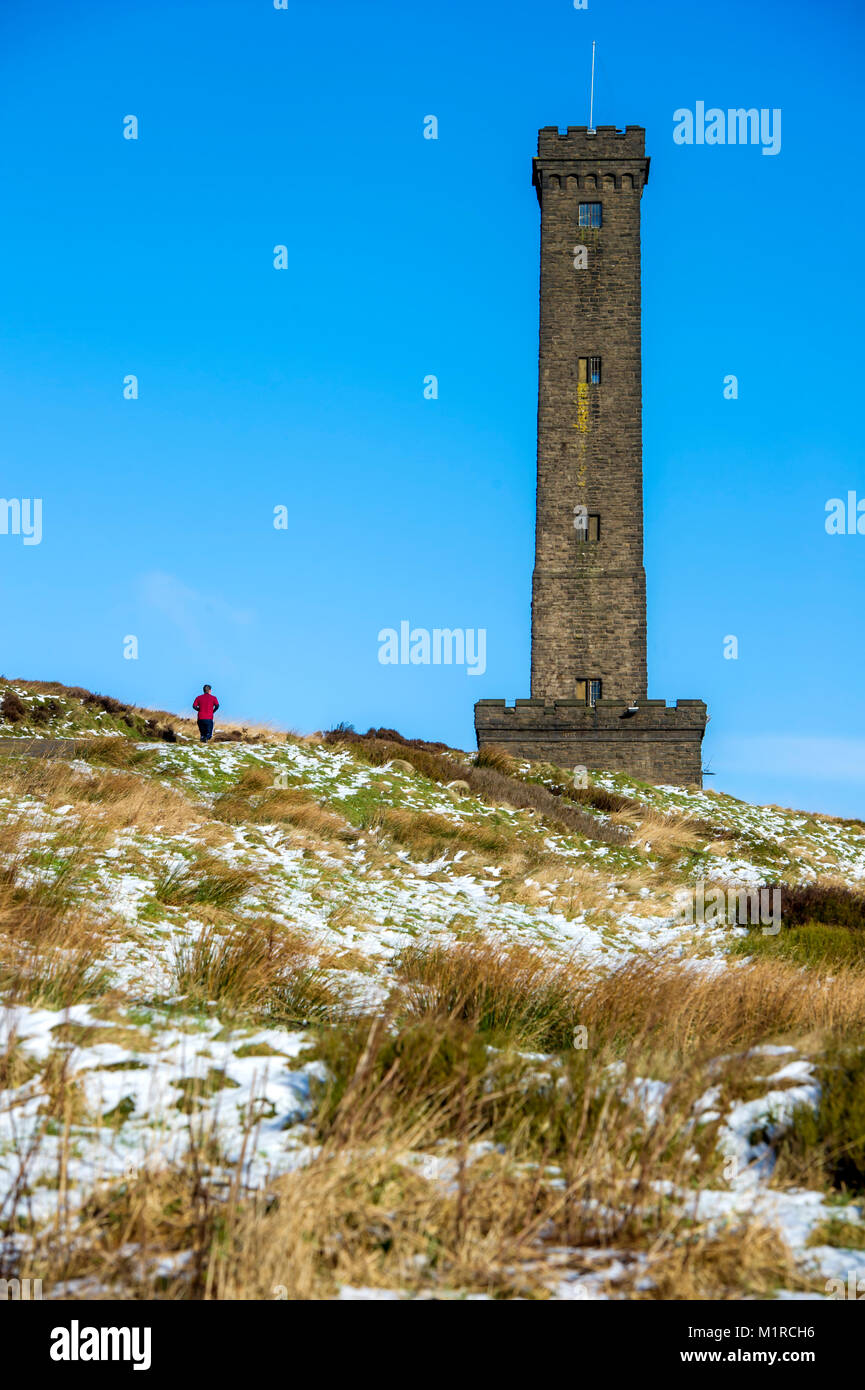 Holcombe Hill, Lancashire, UK. 1st February, 2018. Beautiful cold, crisp and sunny weather on the first day of February at Holcombe Hill, near Bury, Lancashire, as a dusting of snow covers the hill top near the Peel Monument. Built in 1852 this well known Bury landmark was erected in tribute to one of Bury's most famous sons, Sir Robert Peel; founder of the Police force and Prime Minister 1841-1846. Picture by Paul Heyes, Thursday February 01, 2018. Credit: Paul Heyes/Alamy Live News Stock Photo