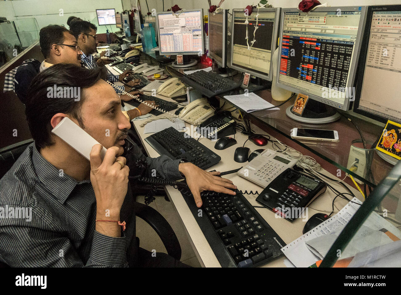 (180201) -- KOLKATA, Feb. 1, 2018 (Xinhua) -- Stock dealers work at a brokerage house in Kolkata, India, on Feb. 1, 2018. The Indian government on Thursday unveiled its budget for the financial year 2018-19, with a focus on agriculture, infrastructure and healthcare. (Xinhua/Tumpa Mondal)(jmmn) Stock Photo