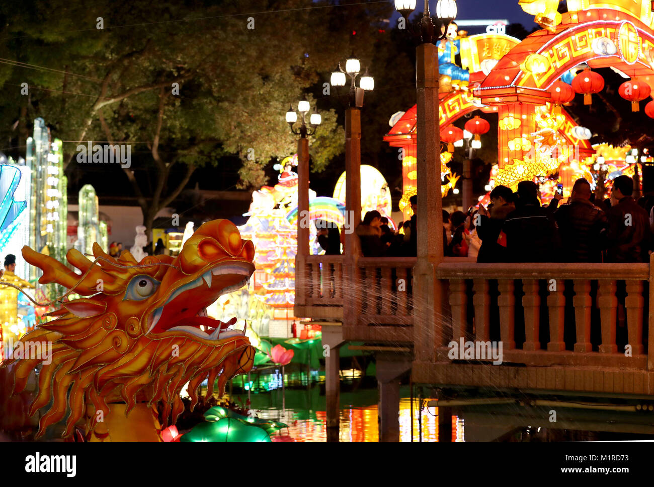 Shanghai. 1st Feb, 2018. People visit lanterns during a lantern fair at ...