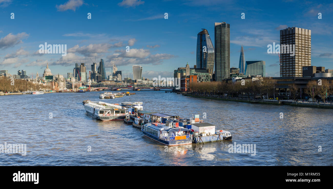 View of the City of London Skyline across the River Thames from Waterloo Bridge on a bright sunny day. Stock Photo