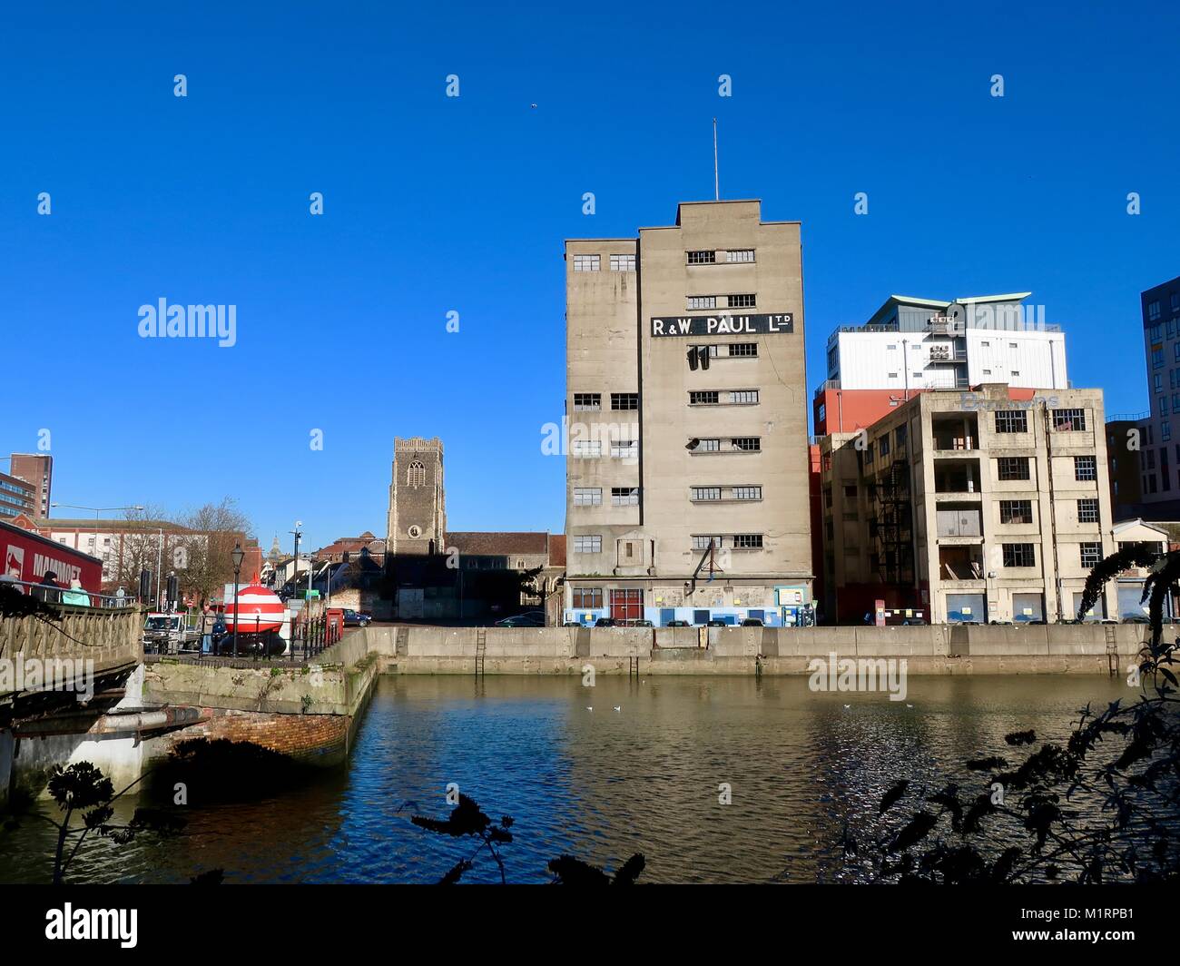 Derelict buildings alongside modern flats / apartments at Ipswich