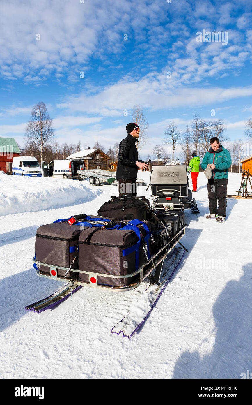 Overbygd, Norway. Team loadout on snowmobile sled Stock Photo - Alamy