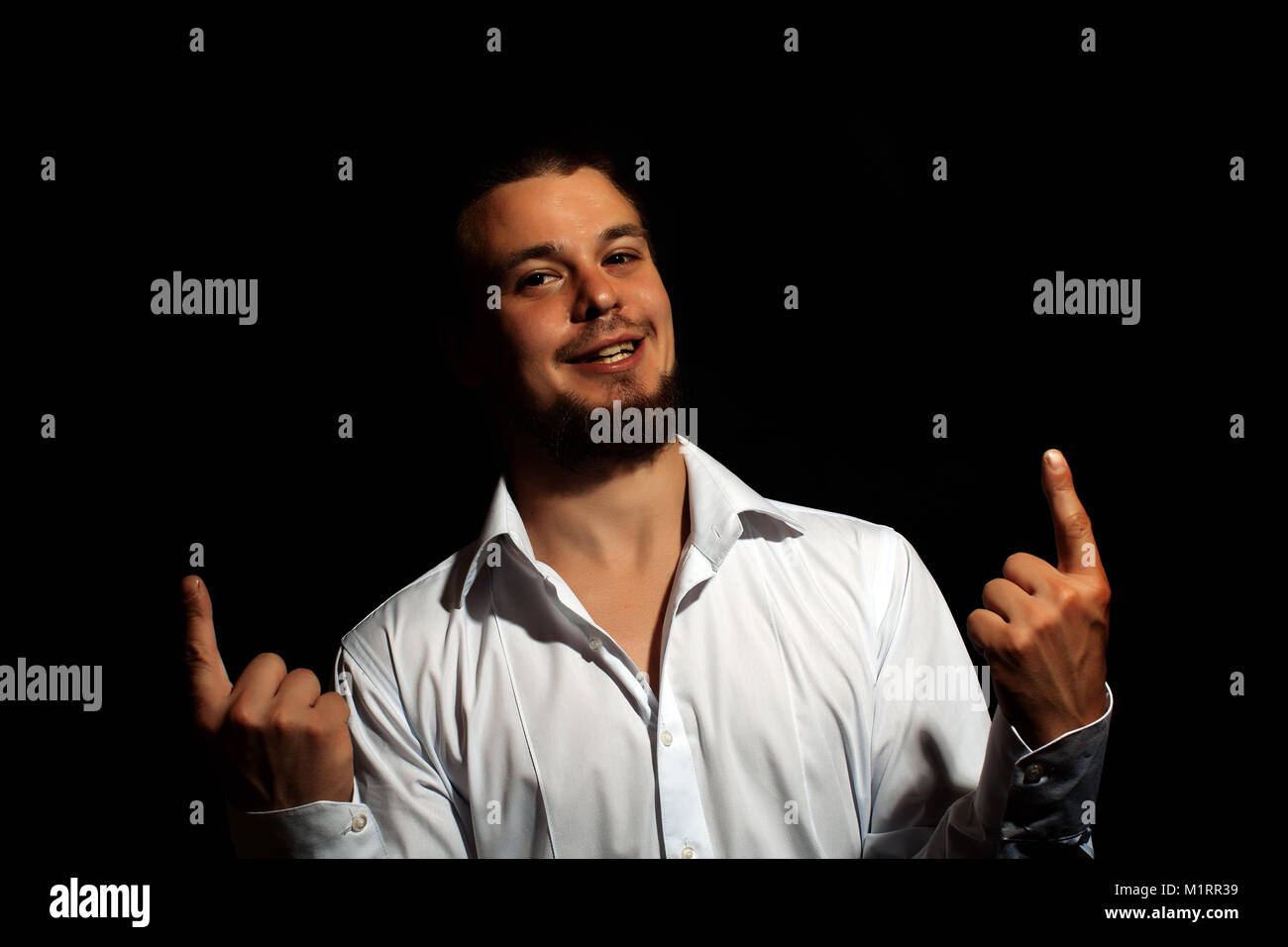 Portrait of a man on a black background. young man close up portrait ...
