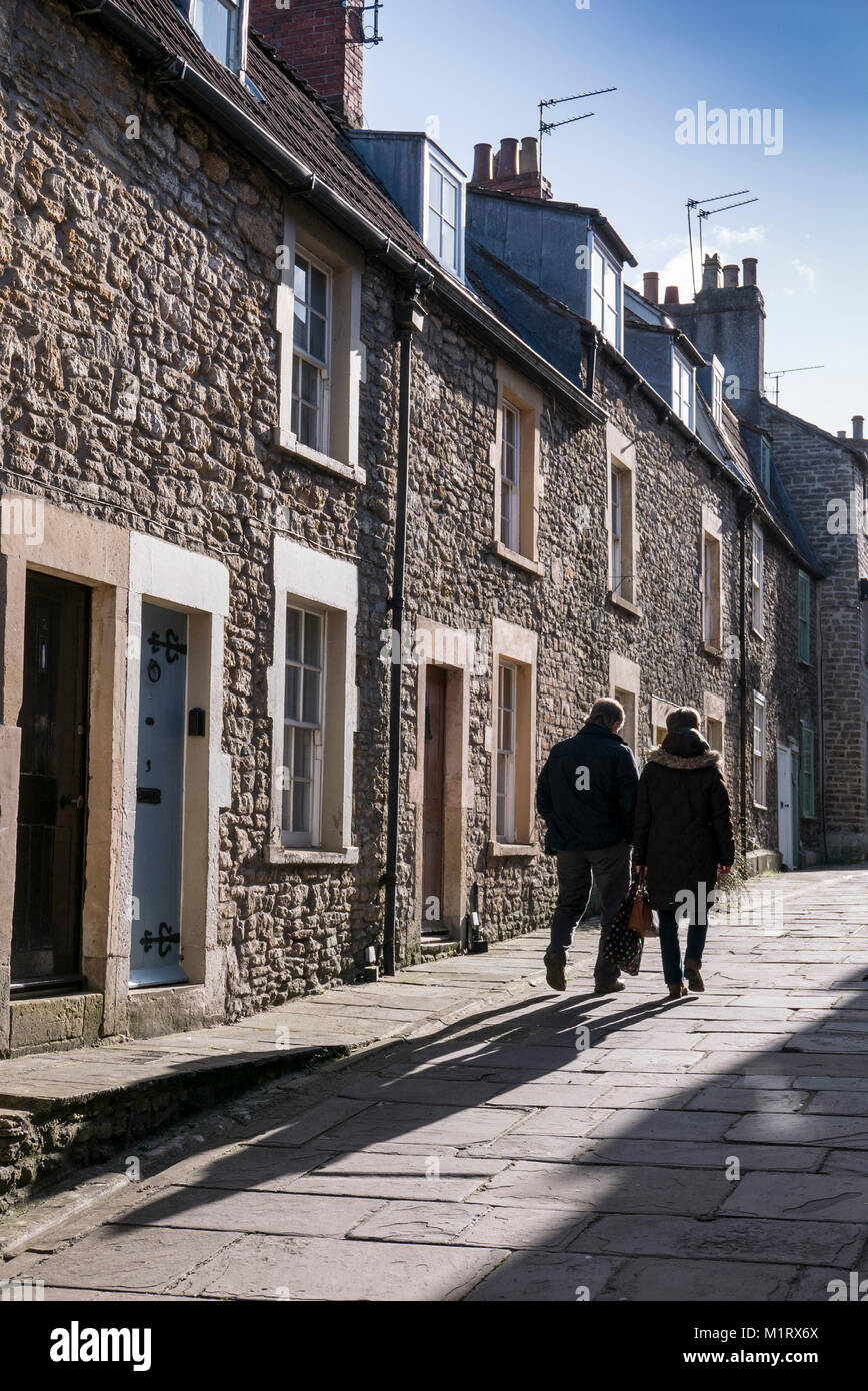 A couple walking in Sheppards Barton, Frome, Somerset, England Stock