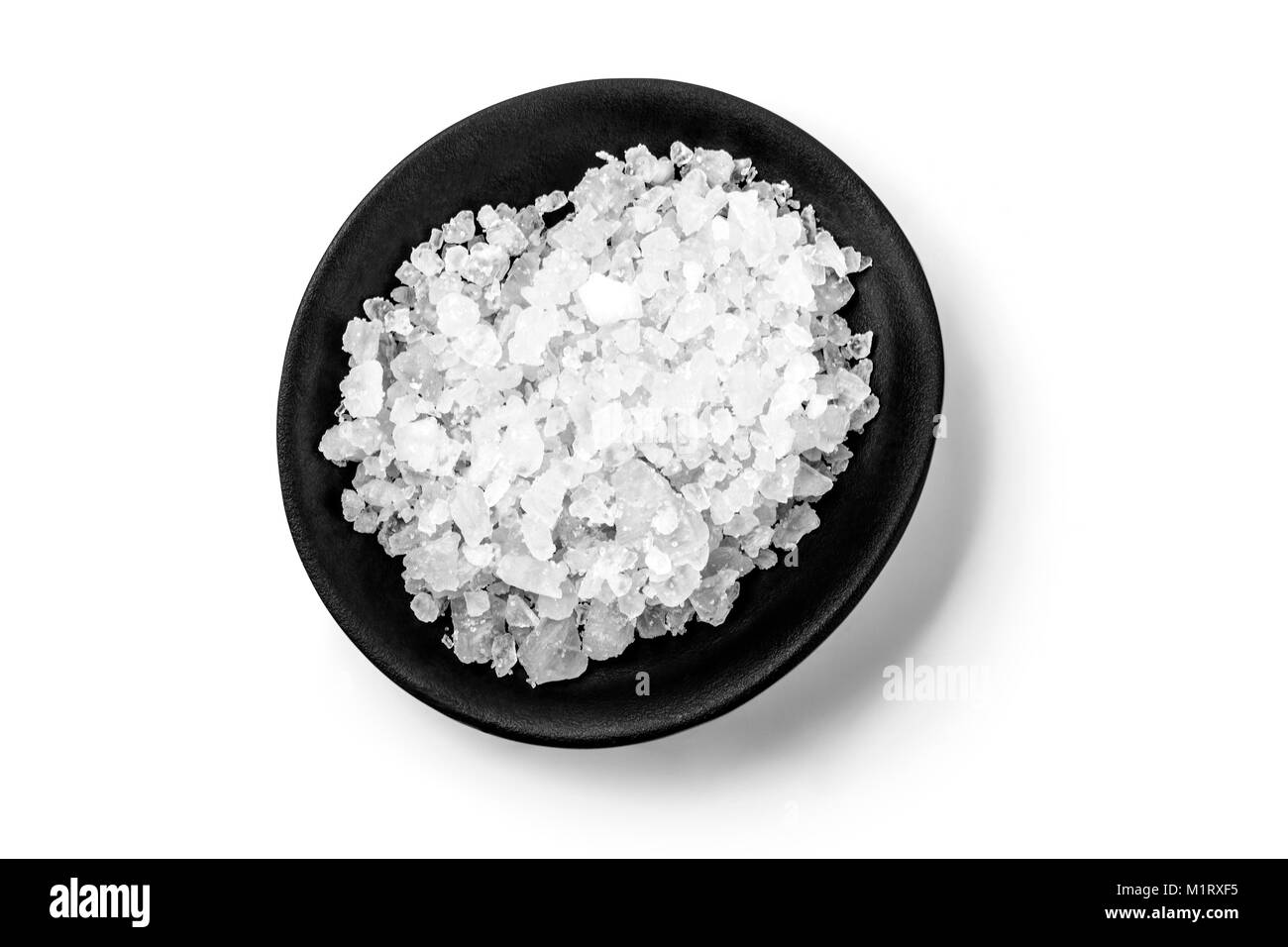 black bowl with salt isolated on white with clipping path Stock Photo