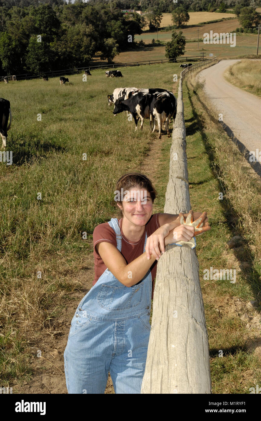 portrait of a farmer with her cows in the field Stock Photo - Alamy