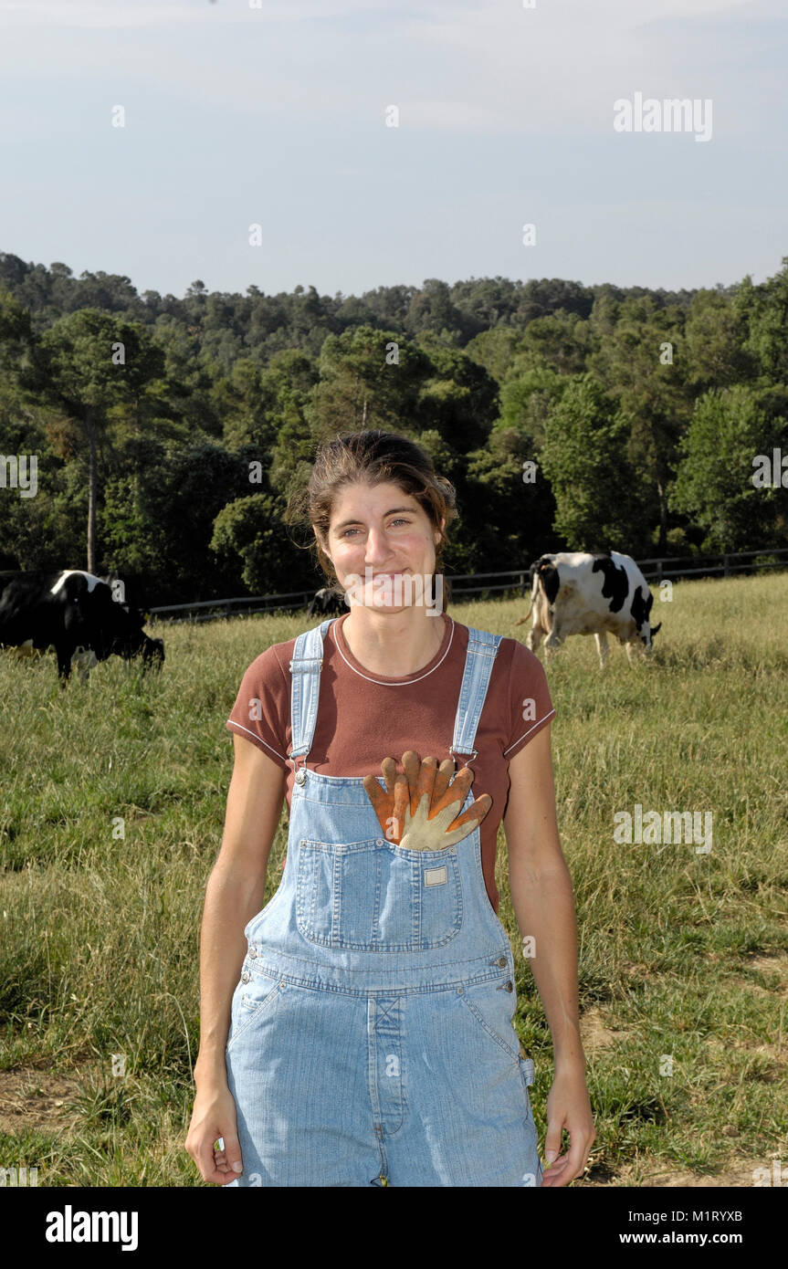 portrait of a woman farmer with some cows Stock Photo - Alamy