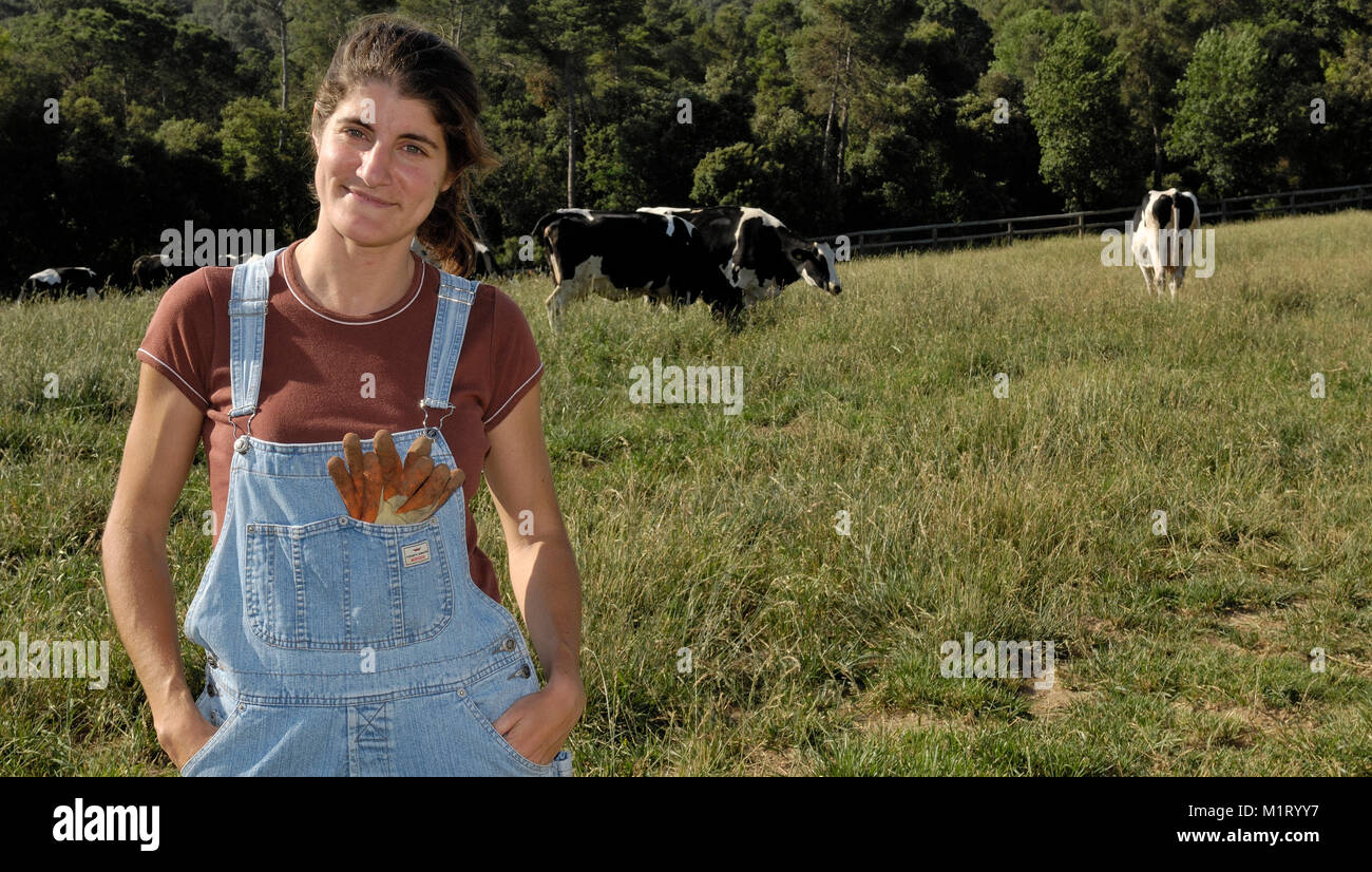 portrait of a woman farmer with some cows Stock Photo - Alamy