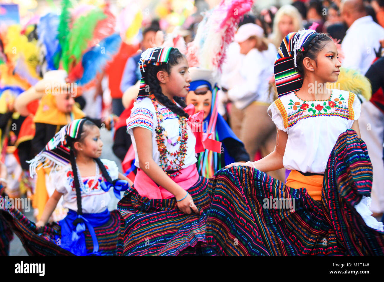 mexican girls dressed with traditional mexican folk costumes handmade skirt with mexican patterns, mexican carnival, editorial use only Stock Photo
