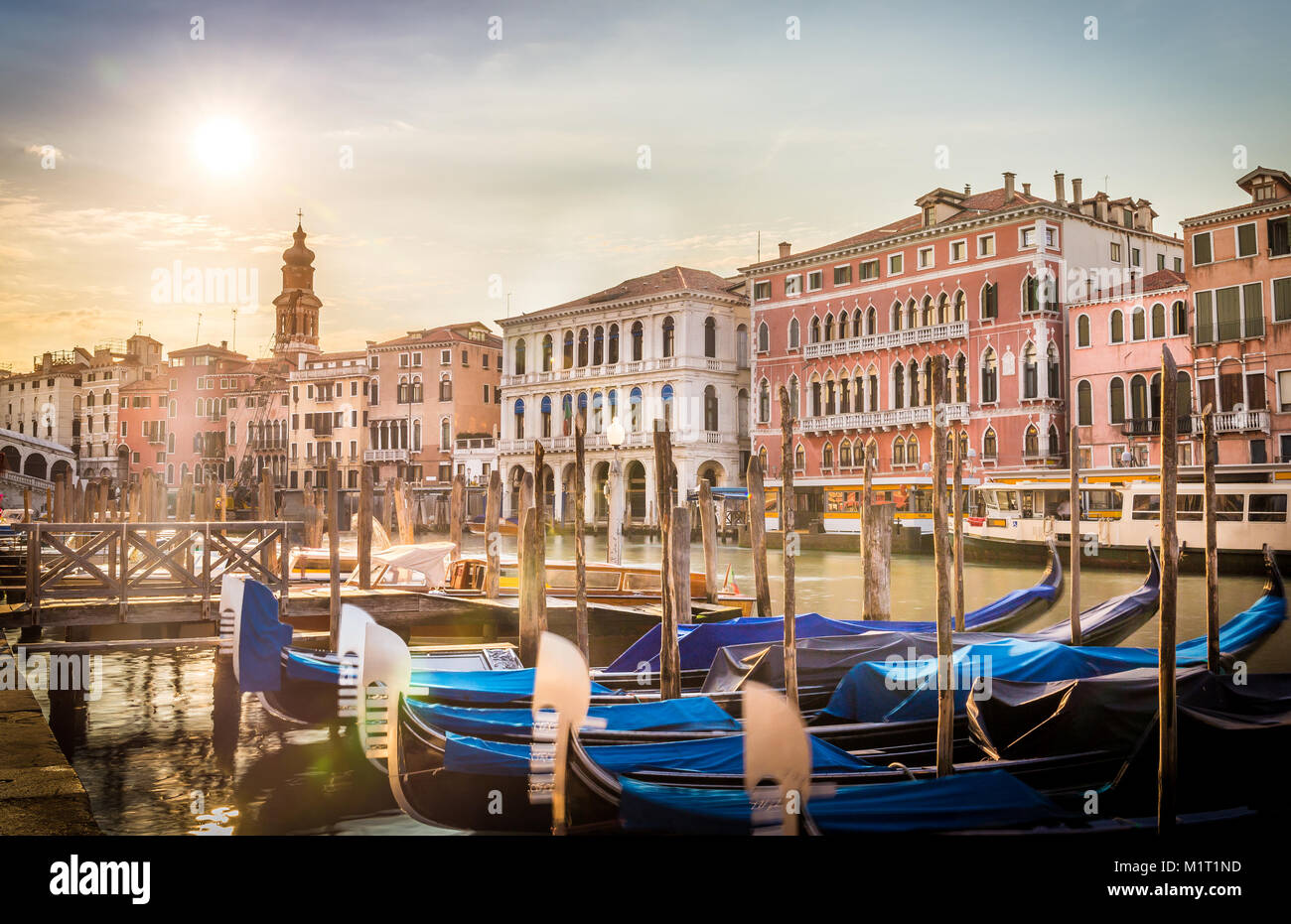 Early morning in Venice with blue gondolas in the foreground Stock ...