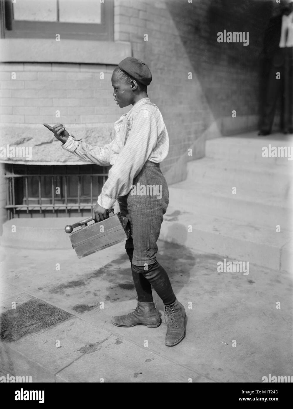 Young Boy with Shoe Shine Kit, Detroit Publishing Company, 1901 Stock Photo