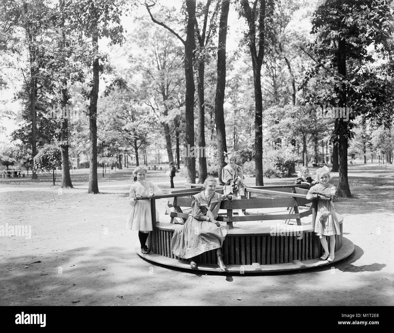 Group of Young Girls on Merry-go-round, Clark Park, Detroit, Michigan, USA, Detroit Publishing Company, early 1900's Stock Photo
