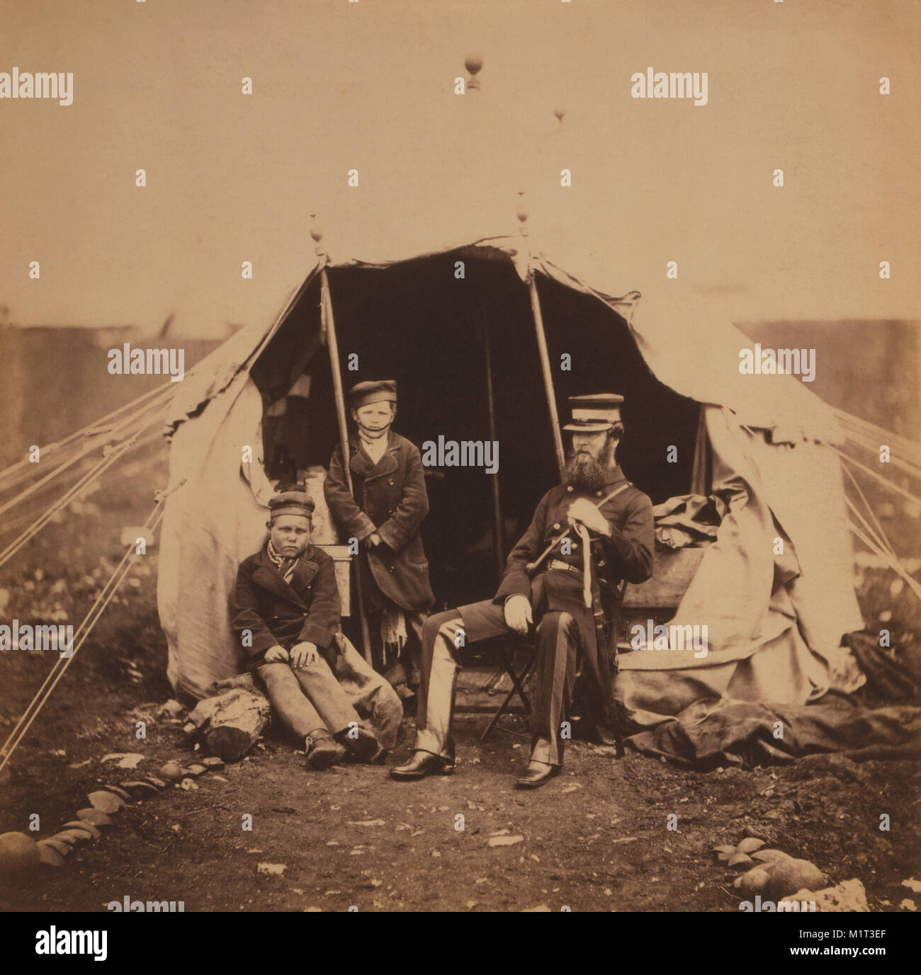 British Colonel Studholme Brownrigg with two Captured Russian Boys, Portrait at Entrance to Tent, Crimean War, Crimea, Ukraine, by Roger Fenton, 1855 Stock Photo