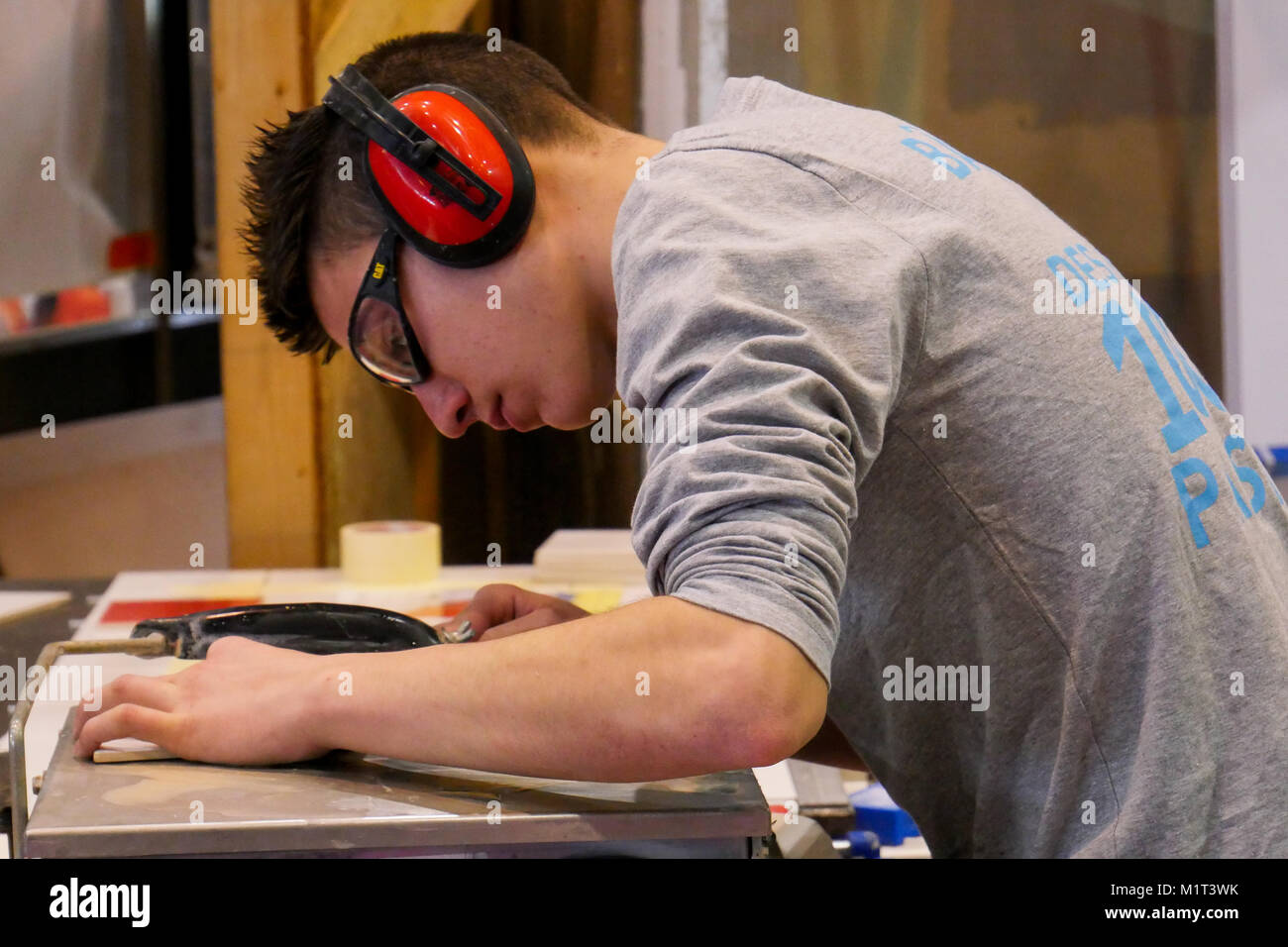 Young apprentice tilesetter at work, Lyon, France Stock Photo Alamy