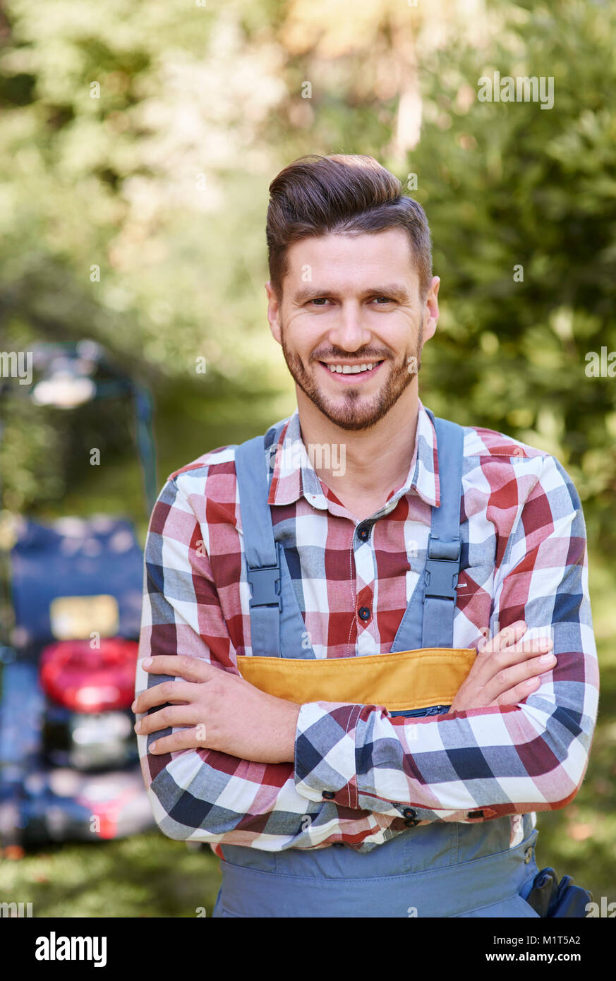 Portrait of cheerful gardener outdoors Stock Photo - Alamy