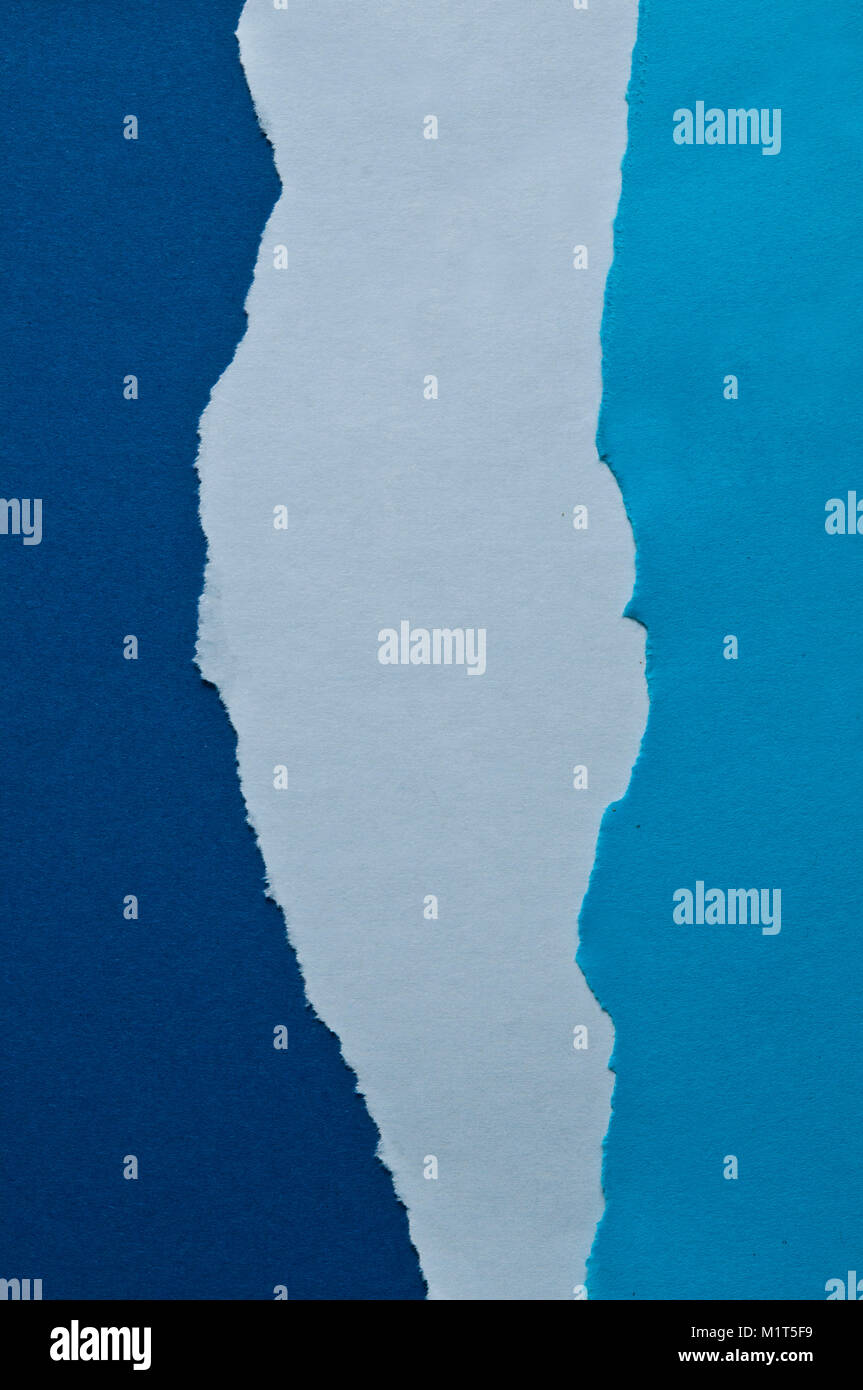 blue abstract background of ripped paper in different gradation of ...