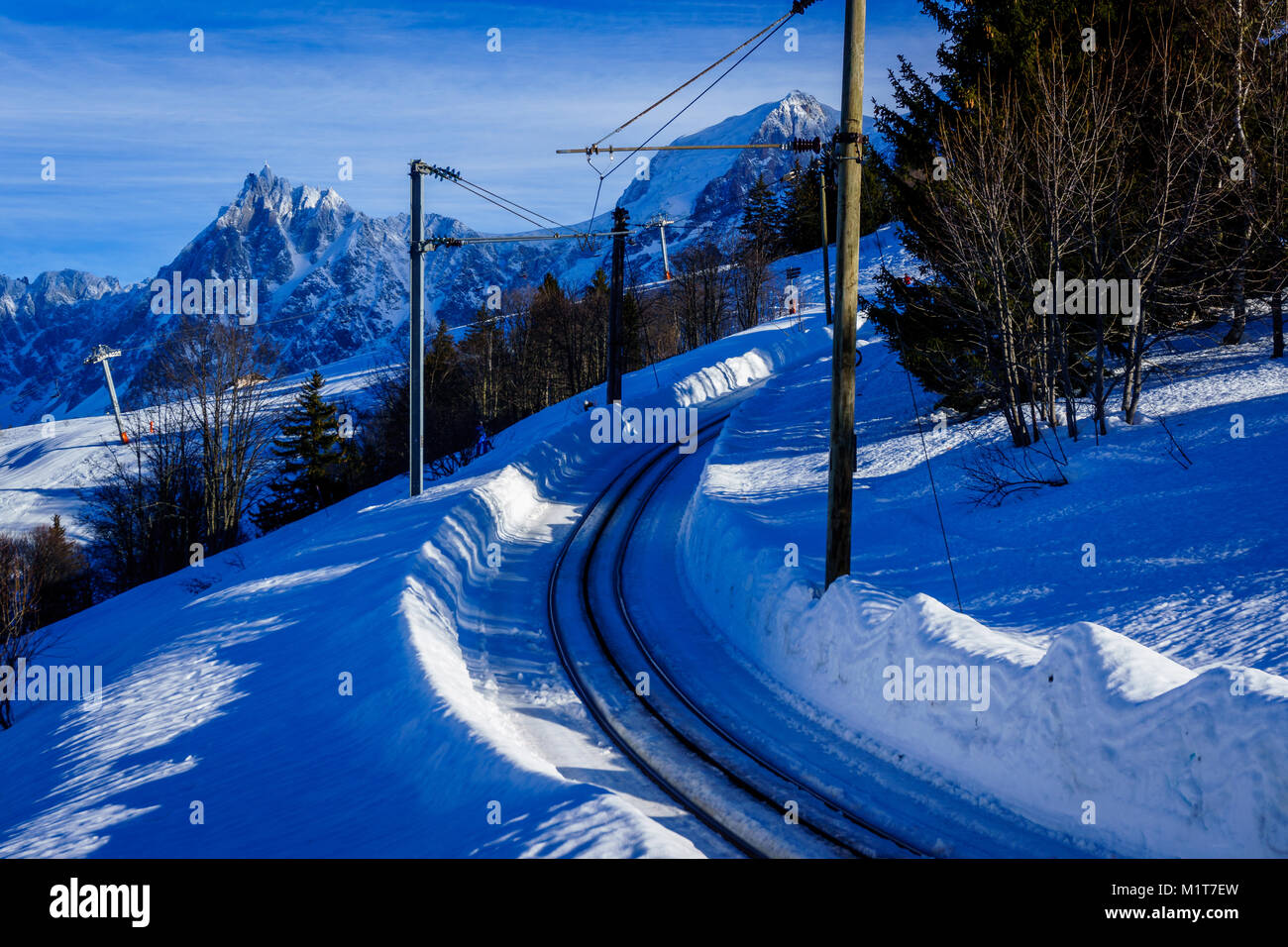 Beautiful landscape of snowy mountain view with a spruce of pine trees in Bellvue Saint-Gervais-les-Bains. Alps mountaintop near Mont Blanc. Stock Photo