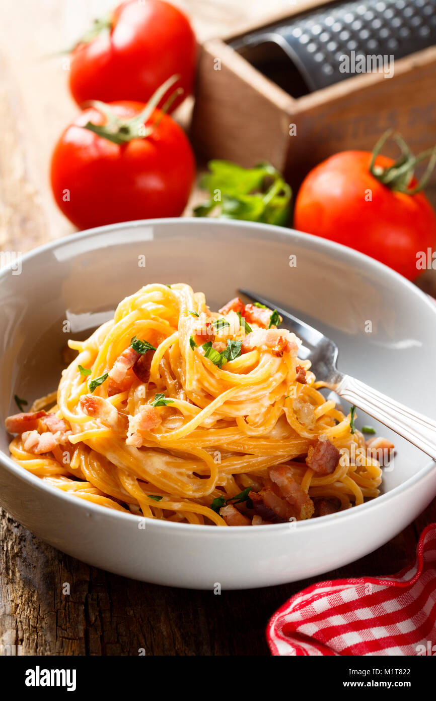Tomato pasta with egg sauce, cheese and ham Stock Photo Alamy