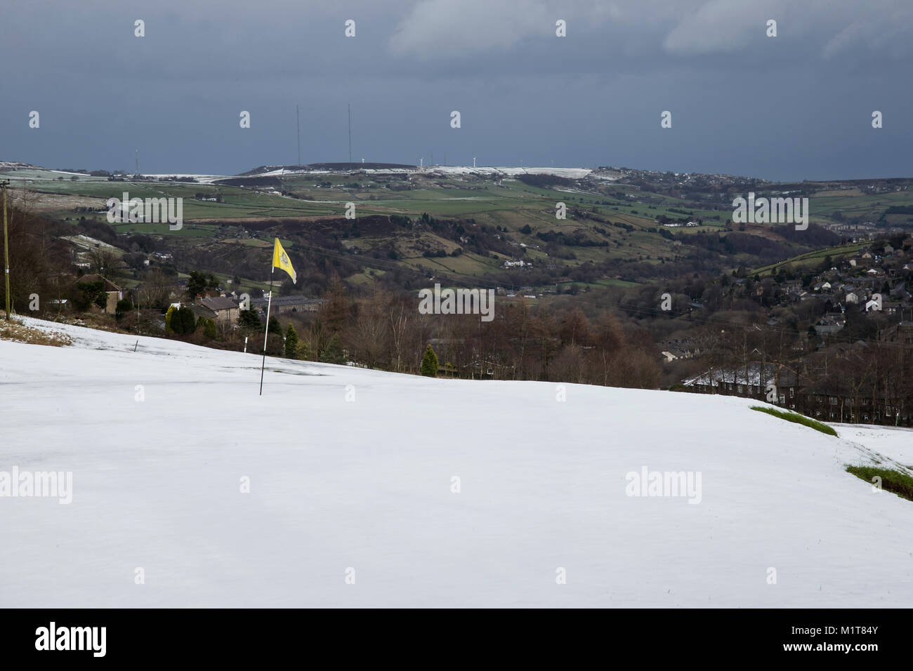 Golf course green covered in snow on the Yorkshire uplands Stock Photo