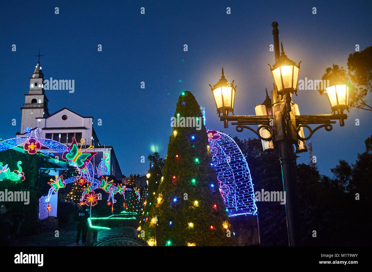 BOGOTA, COLOMBIA - JANURAY 6, 2015: Some Christmas decoration at the top of the hill Monserrate, with its church in the background. Stock Photo