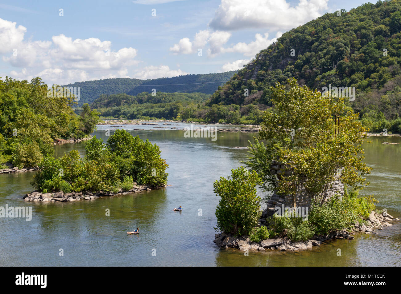 People tubing down the Potomac River, Harper's Ferry National Historic Park, West Virginia, United States. Stock Photo