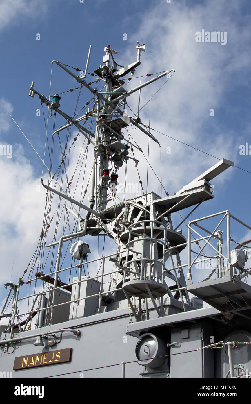 Radar and antenna`s on top of a military ship in the harbor of