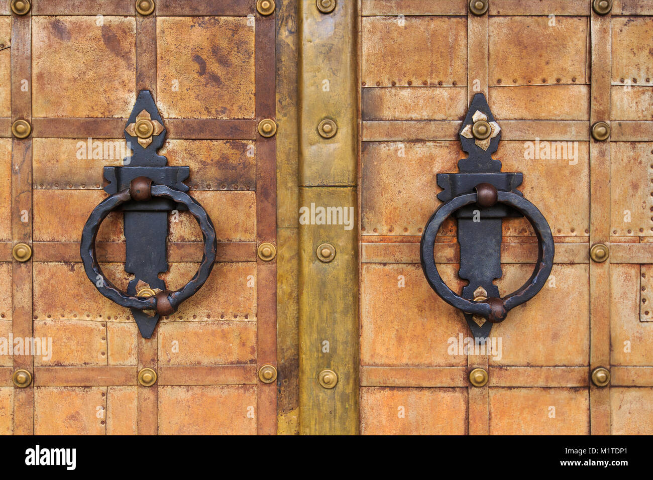 wrought iron doors. with circular handle Stock Photo Alamy
