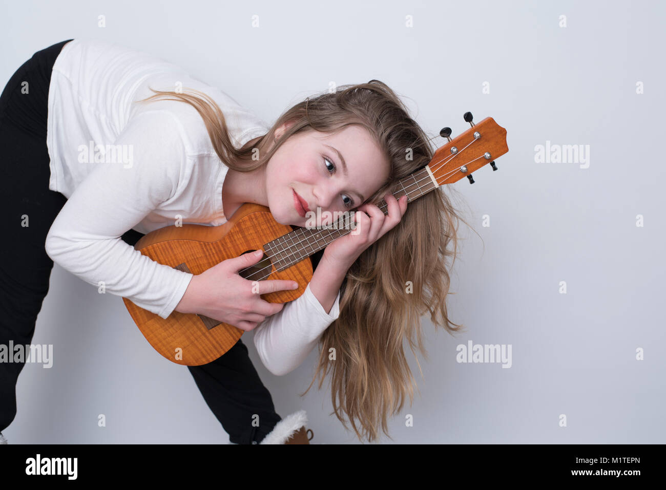 Girl ukulele hi-res stock photography and images - Alamy