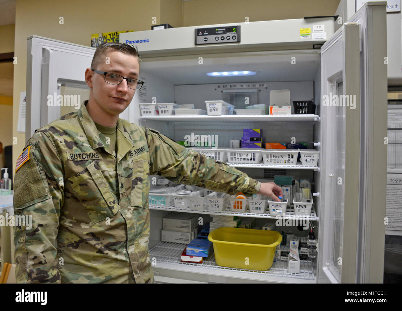 Sgt. Christopher Hutchins, NCOIC at Tripler Army Medical Center’s Allergy & Immunizations Clinic prepares the clinic to administer the Measles, Mumps, Rubella vaccine to patients and staff members at Tripler Army Medical Center, Jan. 31, 2018. Stock Photo