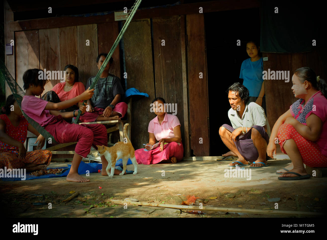 Rubber tapping workers from Burma rest in front of their dwelling place in koh Yao Yai, a Thai island in the Andaman Sea. 20-Jan-2018 Stock Photo