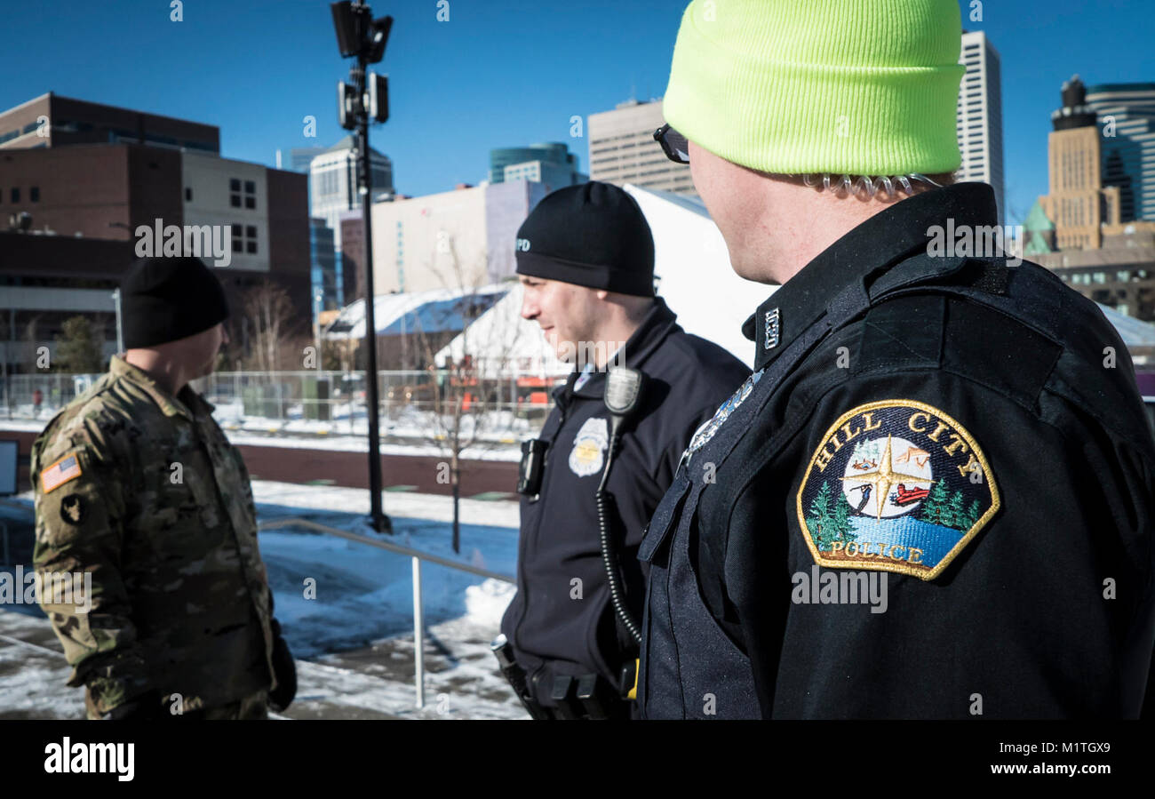 A Minnesota Guardsman Speaks To Law Enforcement Officers While On Duty a-minnesota-guardsman-speaks-to-law-enforcement-officers-while-on-duty